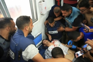 Al Jazeera cameraman in a coma after being shot by Israeli forces